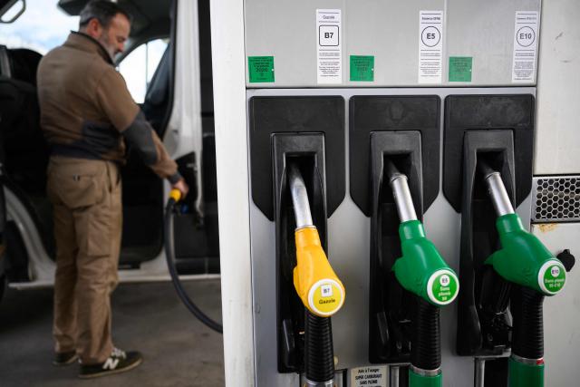 A man fills in his truck with diesel at a petrol station in Saint-Etienne-de-Montluc, western France, on April 15, 2026, as US-Israel war on Iran, launched on February 28, has roiled global energy and equities markets, sending oil prices skyrocketing after Tehran virtually closed the key Strait of Hormuz. (Photo by Loic VENANCE / AFP)