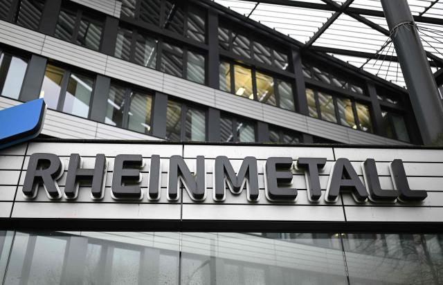 (FILES) The logo of German automotive and arms manufacturer Rheinmetall is pictured prior to a virtual press conference to present their 2025 annual results at the company's headquarters in Duesseldorf, western Germany, on March 11, 2026. Germany's parliament awarded defence giant Rheinmetall a contract Wednesday to supply attack drones for the national military, a lawmaker told on April 15, 2026. The deal with Rheinmetall -- which was not publicly named as a supplier -- follows contracts with defence tech start-ups Stark and Helsing approved by the legislature in February. Rheinmetall's contract to deliver attack drones is worth roughly 298 million euros (USD 352 million) "if quality standards are met", lawmaker Andreas Schwartz from the centre-left SPD, who sits on the parliament's budget committee, told AFP. (Photo by INA FASSBENDER / AFP)