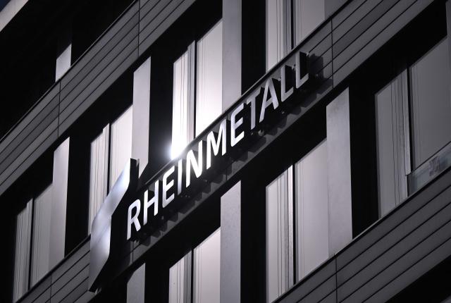 (FILES) The logo of German weapons producer and automotive supplier Rheinmetall is seen at the company's headquarters during the annual results press conference in Duesseldorf, western Germany, on March 14, 2024. Germany's parliament awarded defence giant Rheinmetall a contract Wednesday to supply attack drones for the national military, a lawmaker told on April 15, 2026. The deal with Rheinmetall -- which was not publicly named as a supplier -- follows contracts with defence tech start-ups Stark and Helsing approved by the legislature in February. Rheinmetall's contract to deliver attack drones is worth roughly 298 million euros (USD 352 million) "if quality standards are met", lawmaker Andreas Schwartz from the centre-left SPD, who sits on the parliament's budget committee, told AFP. (Photo by Ina FASSBENDER / AFP)