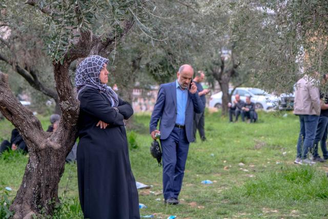 Families wait near a school where a 13 year-old teenager opened fire in Kahramanmaras, on April 15, 2026. A 13-year-old opened fire at a Turkish school on April 15, 2026, killing nine people and wounding 13, with students jumping from windows to escape the second school shooting in the country in as many days, officials said. (Photo by Orhan ERKILIC / AFP)