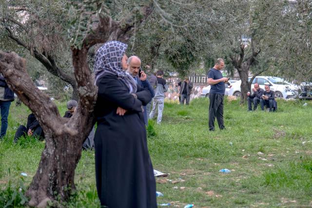 Families wait near a school where a 13 year-old teenager opened fire in Kahramanmaras, on April 15, 2026. A 13-year-old opened fire at a Turkish school on April 15, 2026, killing nine people and wounding 13, with students jumping from windows to escape the second school shooting in the country in as many days, officials said. (Photo by Orhan ERKILIC / AFP)