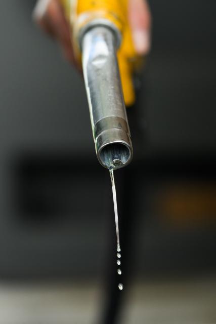 Diesel drips out of a fuel hose at a petrol station in Saint-Etienne-de-Montluc, western France, on April 15, 2026, as US-Israel war on Iran, launched on February 28, has roiled global energy and equities markets, sending oil prices skyrocketing after Tehran virtually closed the key Strait of Hormuz. (Photo by Loic VENANCE / AFP)