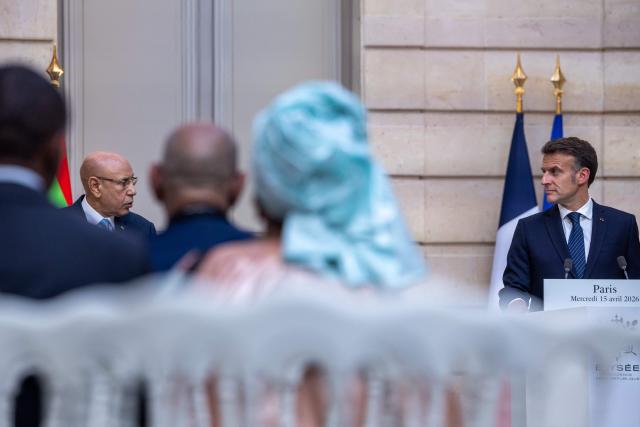 France's President Emmanuel Macron (R) and Mauritania's President Mohamed Ould Cheikh El Ghazouani (L) hold a joint press conference ahead of a state banquet at the Elysee Presidential Palace in Paris on April 15, 2026. (Photo by Christophe PETIT TESSON / POOL / AFP)
