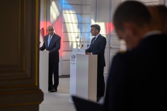 France's President Emmanuel Macron (R) and Mauritania's President Mohamed Ould Cheikh El Ghazouani (L) hold a joint press conference ahead of a state banquet at the Elysee Presidential Palace in Paris on April 15, 2026. (Photo by Christophe PETIT TESSON / POOL / AFP)