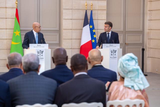 France's President Emmanuel Macron (R) and Mauritania's President Mohamed Ould Cheikh El Ghazouani (L) give a joint press conference ahead of a state banquet at the Elysee Presidential Palace in Paris on April 15, 2026. (Photo by Christophe PETIT TESSON / POOL / AFP)