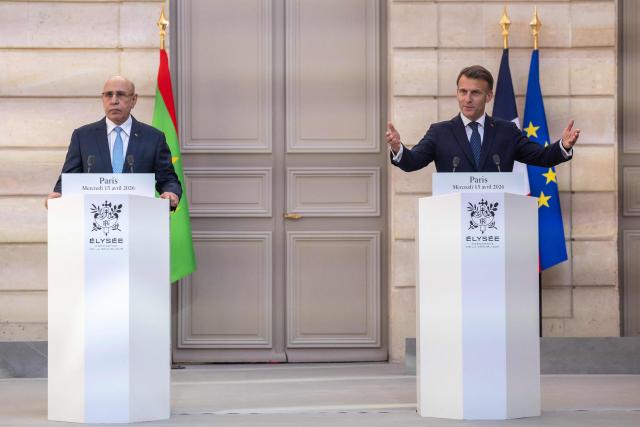 France's President Emmanuel Macron (R) and Mauritania's President Mohamed Ould Cheikh El Ghazouani (L) give a joint press conference ahead of a state banquet at the Elysee Presidential Palace in Paris on April 15, 2026. (Photo by Christophe PETIT TESSON / POOL / AFP)