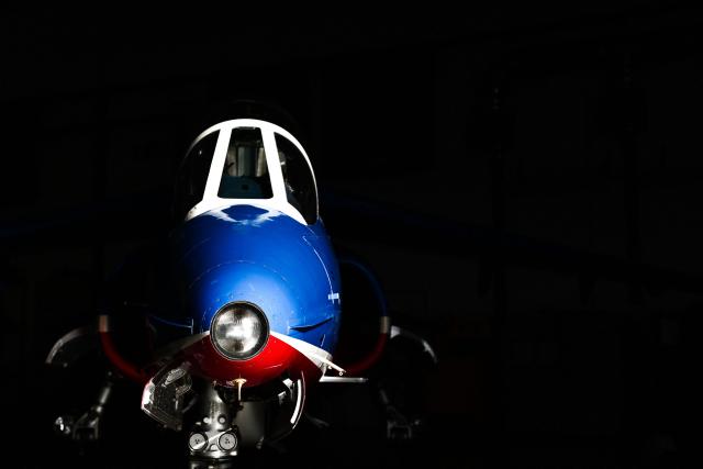 An Alphajet aircraft from France's Air Force elite aerobatic flying team "Patrouille de France" (PAF) is parked in a hangar ahead of a training session at 701 Air Base in Salon-de-Provence, south-eastern France on April 15, 2026. (Photo by Thibaud MORITZ / AFP)