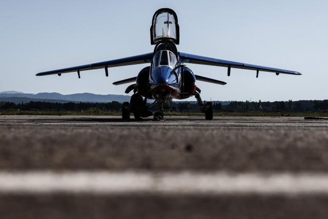 This photograph shows an Alphajet aircraft from France's Air Force elite aerobatic flying team "Patrouille de France" (PAF) is parked in a hangar ahead of a training session at 701 Air Base in Salon-de-Provence, south-eastern France on April 15, 2026. (Photo by Thibaud MORITZ / AFP)