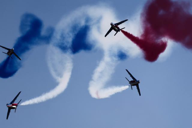 France's Air Force elite aerobatic flying team "Patrouille de France" (PAF) releases trails of France's national colours as they take part in a training session at 701 Air Base in Salon-de-Provence, south-eastern France on April 15, 2026. (Photo by Thibaud MORITZ / AFP)