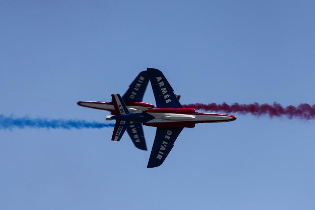 France's Air Force elite aerobatic flying team "Patrouille de France" (PAF) releases trails of France's national colours as they take part in a training session at 701 Air Base in Salon-de-Provence, south-eastern France on April 15, 2026. (Photo by Thibaud MORITZ / AFP)