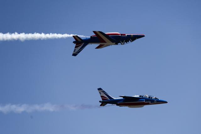 France's Air Force elite aerobatic flying team "Patrouille de France" (PAF) releases trails of France's national colours as they take part in a training session at 701 Air Base in Salon-de-Provence, south-eastern France on April 15, 2026. (Photo by Thibaud MORITZ / AFP)