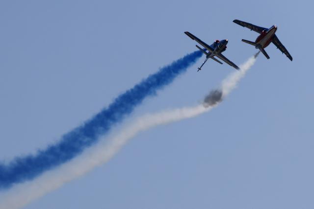 France's Air Force elite aerobatic flying team "Patrouille de France" (PAF) releases trails of France's national colours as they take part in a training session at 701 Air Base in Salon-de-Provence, south-eastern France on April 15, 2026. (Photo by Thibaud MORITZ / AFP)