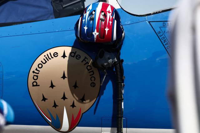 This photograph shows an helmet hanging on an Alphajet aicraft from France's Air Force Elite aerobatic flying team "Patrouille de France" (PAF) and the logo of the team at 701 Air Base in Salon-de-Provence, south-eastern France on April 15, 2026. (Photo by Thibaud MORITZ / AFP)