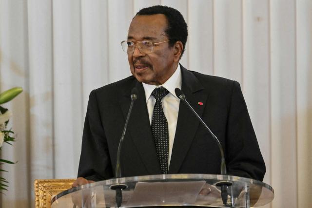 Cameroon's President Paul Biya delivers a speech with Pope Leo XIV (unseen) in attendance at The Presidential Palace in Yaounde, on the third day of an 11-day apostolic journey to Africa, on April 15, 2026. (Photo by Alberto PIZZOLI / AFP)
