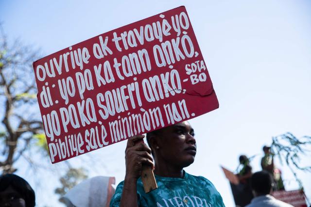 Protestors rally against rising fuel prices in Port-au-Prince, Haiti, on April 15, 2026. Workers say that fuel prices should not exceed their minimum wage. Crude prices climbed Wednesday while stocks diverged as investors digested mixed signals about talks to end the war in the Middle East and get oil and gas flowing through the Strait of Hormuz once again. (Photo by Clarens SIFFROY / AFP)