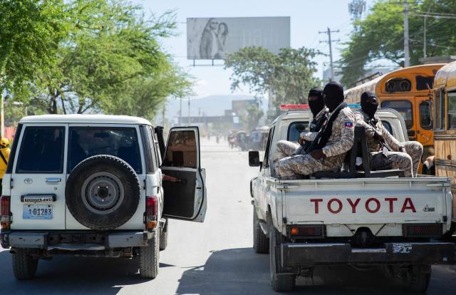 Police officers monitor the area as protestors rally against rising fuel prices in Port-au-Prince, Haiti, on April 15, 2026. Workers say that fuel prices should not exceed their minimum wage. Crude prices climbed Wednesday while stocks diverged as investors digested mixed signals about talks to end the war in the Middle East and get oil and gas flowing through the Strait of Hormuz once again. (Photo by Clarens SIFFROY / AFP)