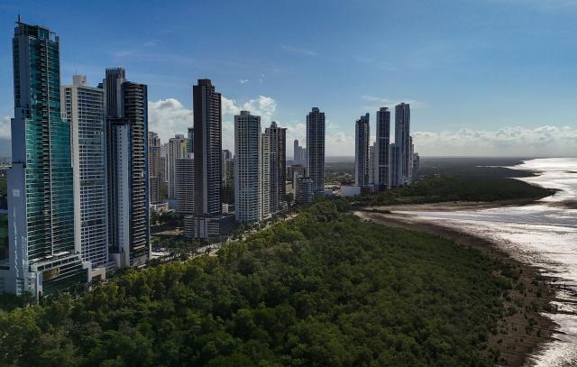 Aerial view of the skyscrapers at the exclusive Costa del Este district, a modern residential and commercial area in Panama City, on April 15, 2026. (Photo by Martin BERNETTI / AFP)