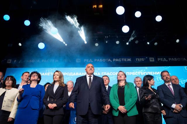 Bulgaria's conservative GERB party leader and former prime minister Boyko Borisov posses with his party members the final campaign rally ahead of general elections, in Samokov on April 15, 2026. Bulgaria will hold its eighth general election in five years on April 19, 2026, with the ex-president's new grouping tipped to win a ballot many hope will end chronic instability. (Photo by Nikolay DOYCHINOV / AFP)