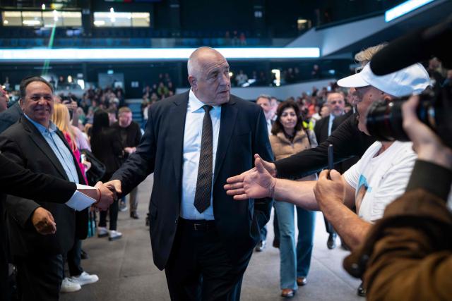 Bulgaria's conservative GERB party leader and former prime minister Boyko Borisov  shakes hands with supporters during the final campaign rally ahead of general elections, in Samokov on April 15, 2026. Bulgaria will hold its eighth general election in five years on April 19, 2026, with the ex-president's new grouping tipped to win a ballot many hope will end chronic instability. (Photo by Nikolay DOYCHINOV / AFP)