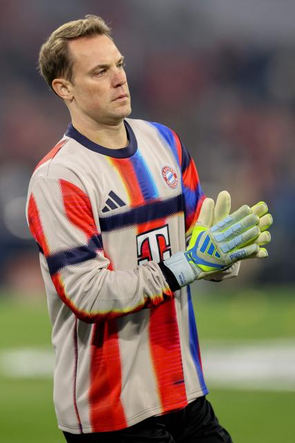 Bayern Munich's German goalkeeper #01 Manuel Neuer warms up prior to the UEFA Champions League quarter-final second leg football match between FC Bayern Munich and Real Madrid in Munich, southern Germany, on April 15, 2026. (Photo by Alexandra BEIER / AFP)