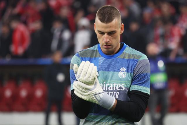 Real Madrid's Ukrainian goalkeeper #13 Andriy Lunin is pictured prior to the start of the UEFA Champions League quarter-final second leg football match between FC Bayern Munich and Real Madrid in Munich, southern Germany, on April 15, 2026. (Photo by Karl-Josef HILDENBRAND / AFP)