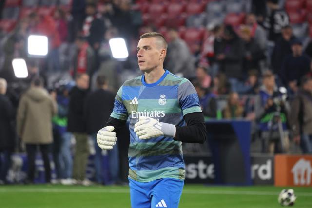 Real Madrid's Ukrainian goalkeeper #13 Andriy Lunin is pictured prior to the start of the UEFA Champions League quarter-final second leg football match between FC Bayern Munich and Real Madrid in Munich, southern Germany, on April 15, 2026. (Photo by Karl-Josef HILDENBRAND / AFP)