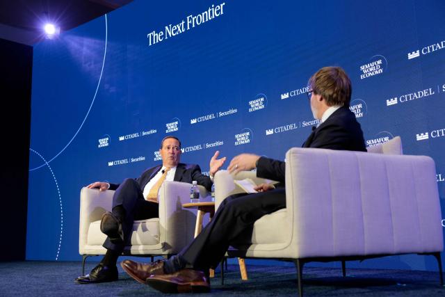 Chuck Robbins (L), CEO of Cisco Systems, speaks with Reed Albergotti, Semafor's Techonolgy Editor, during the 2026 Semafor World Economy conference in Washington, DC, on April 15, 2026. (Photo by Kent Nishimura / AFP)