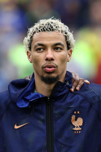 (FILES) France's forward #09 Hugo Ekitike stands for the national anthems ahead of a friendly football match between Brazil and France at Gillette Stadium in Foxborough, Massachusetts, on March 26, 2026. France coach Didier Deschamps confirmed on April 15, 2026, that the serious injury suffered by Liverpool forward Hugo Ekitiké on April 14, 2026 in the Champions League match against PSG "will unfortunately prevent him from finishing the season with Liverpool and from participating in the World Cup." (Photo by FRANCK FIFE / AFP)