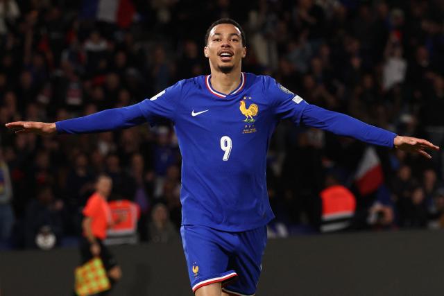 (FILES) France's forward #09 Hugo Ekitike celebrates after scoring his team fourth goal during the 2026 World Cup qualifiers Europe zone group D football match between France and Ukraine at the Parc des Princes stadium in Paris, on November 13, 2025. France coach Didier Deschamps confirmed on April 15, 2026, that the serious injury suffered by Liverpool forward Hugo Ekitiké on April 14, 2026 in the Champions League match against PSG "will unfortunately prevent him from finishing the season with Liverpool and from participating in the World Cup." (Photo by FRANCK FIFE / AFP)