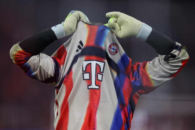 Bayern Munich's German goalkeeper #01 Manuel Neuer pulls his shirt over his head during the warm up prior to the UEFA Champions League quarter-final second leg football match between FC Bayern Munich and Real Madrid in Munich, southern Germany, on April 15, 2026. (Photo by Alexandra BEIER / AFP)