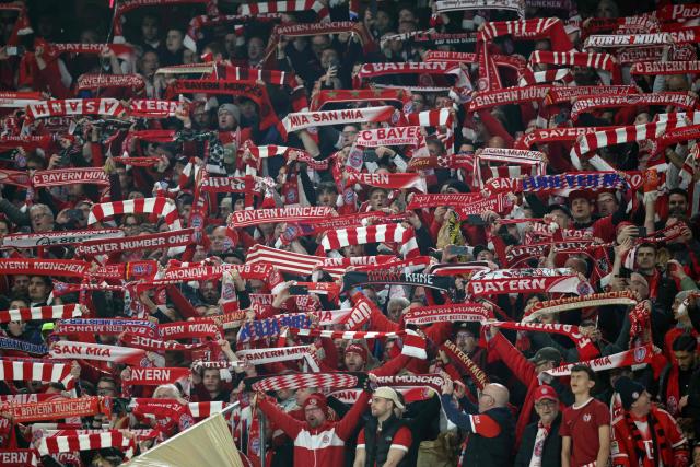 Bayern fans display their scarves prior to the UEFA Champions League quarter-final second leg football match between FC Bayern Munich and Real Madrid in Munich, southern Germany, on April 15, 2026. (Photo by Alexandra BEIER / AFP)