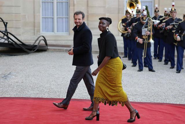 Co-Director of Investisseurs & Partenaires (I&P) Jeremy Hajdenberg (L) and French journalist Liz Gomis arrive at state banquet held in honour of Mauritania's President at the Elysee Presidential Palace in Paris on April 15, 2026. (Photo by Ludovic MARIN / AFP)