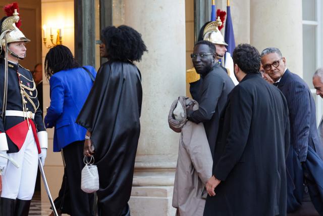 Deputy Mayor of Paris, in charge of youth, republican equality, and popular education Mams Yaffa (C) arrives at a state banquet held in honour of Mauritania's President at the Elysee Presidential Palace in Paris on April 15, 2026. (Photo by Ludovic MARIN / AFP)