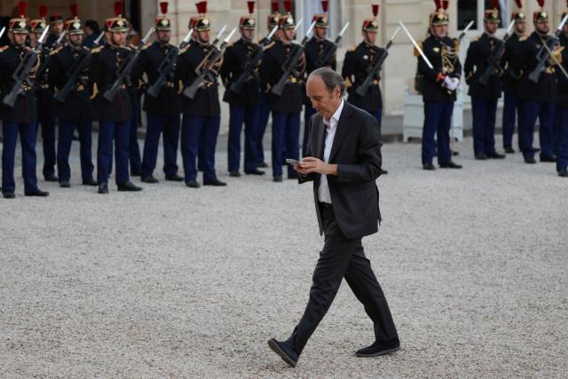 CEO of telecoms giant Iliad, the parent company of Free Telecoms, Xavier  Niel arrives at a state banquet held in honour of Mauritania's President at the Elysee Presidential Palace in Paris on April 15, 2026. (Photo by Ludovic MARIN / AFP)