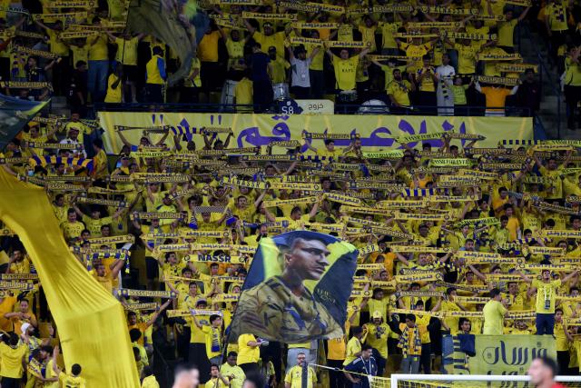 Nassr's fans cheer during the Saudi Pro League football match between Al-Nassr and Al-Ettifaq at the Al-Awwal Park Stadium in Riyadh on April 15, 2026. (Photo by Fayez Nureldine / AFP)
