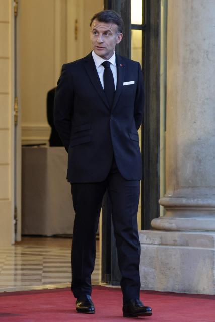France's President Emmanuel Macron reacts as he waits for guests to arrive at a state banquet held in honour of Mauritania's President at the Elysee Presidential Palace in Paris on April 15, 2026. (Photo by Ludovic MARIN / AFP)