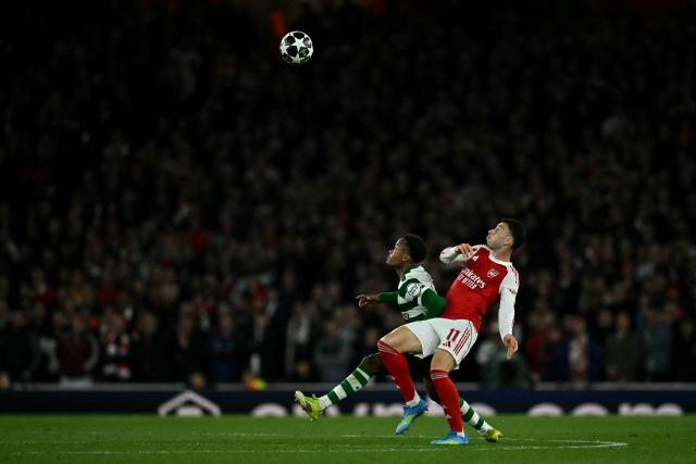 Arsenal's Brazilian midfielder #11 Gabriel Martinelli and Sporting Lisbon's Mozambicans striker #10 Geny Catamo focuse on the ball during the UEFA Champions League quarter-final, second-leg football match between Arsenal and Sporting Lisbon at the Emirates Stadium in north London on April 15, 2026. (Photo by Ben STANSALL / AFP)