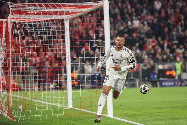 Real Madrid's French forward #10 Kylian Mbappe celebrates scoring the 2-3 goal during the UEFA Champions League quarter-final second leg football match between FC Bayern Munich and Real Madrid in Munich, southern Germany, on April 15, 2026. (Photo by Alexandra BEIER / AFP)