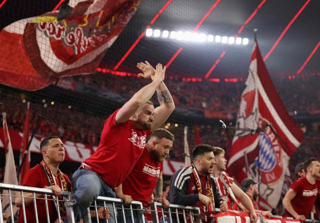 Bayern fans react during the UEFA Champions League quarter-final second leg football match between FC Bayern Munich and Real Madrid in Munich, southern Germany, on April 15, 2026. (Photo by Alexandra BEIER / AFP)