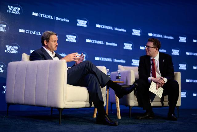 Marcus Lazarus (L), CEO of VERSANT speaks during the 2026 Semafor World Economy conference in Washington, DC, on April 15, 2026. (Photo by Kent NISHIMURA / AFP)