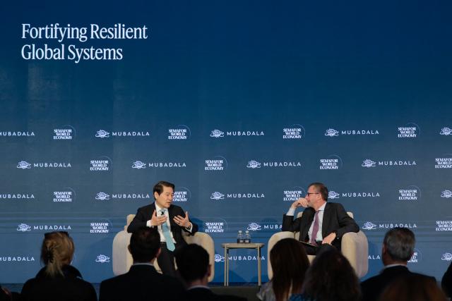 Dr. Huiyao Wang (L), Founder & President of Center for China and Globalization, speaks during the 2026 Semafor World Economy conference in Washington, DC, on April 15, 2026. (Photo by Kent NISHIMURA / AFP)