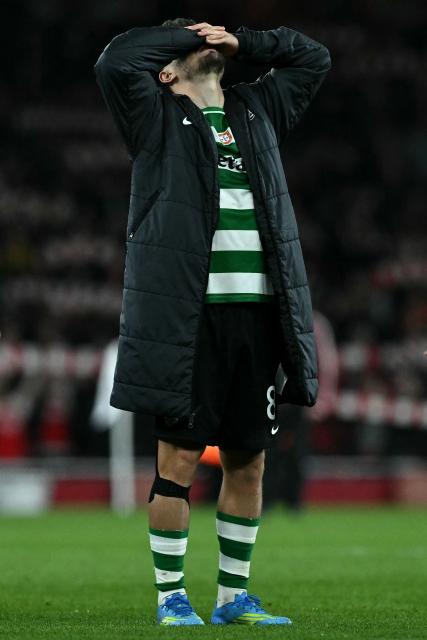 Sporting Lisbon's Portuguese striker #08 Pedro Goncalves reacts after the UEFA Champions League quarter-final, second-leg football match between Arsenal and Sporting Lisbon at the Emirates Stadium in north London on April 15, 2026. (Photo by Ben STANSALL / AFP)