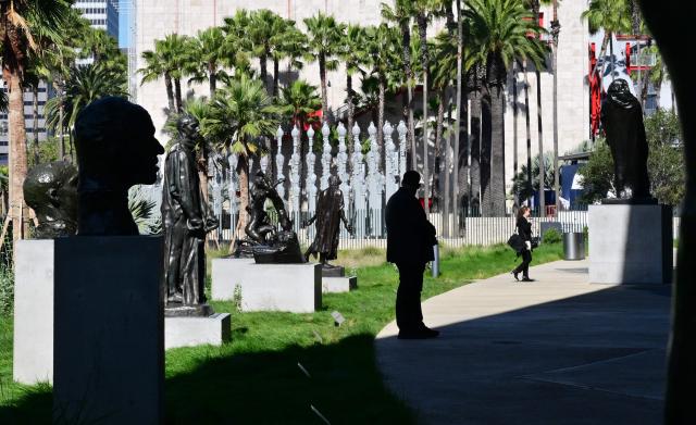 People walk around the Iris and B. Gerald Cantor Scuplture Garden of the David Geffen Galleries at the Los Angeles County Museum of Art (LACMA) on April 15, 2026 in Los Angeles, California, during a media preview ahead of the May 4 opening to the public. (Photo by Frederic J. BROWN / AFP)