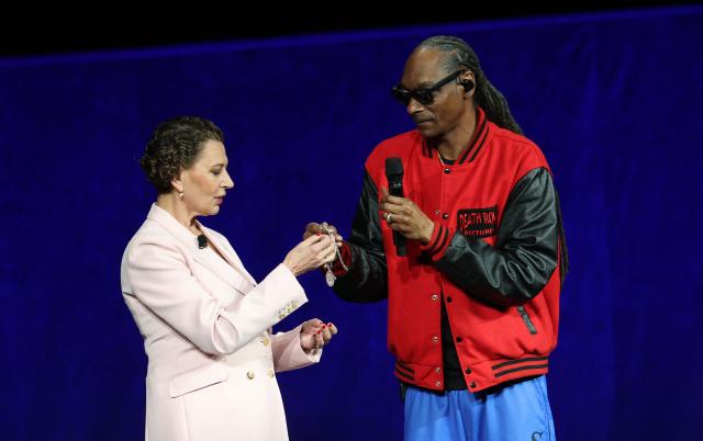 Chairperson of Universal Pictures Donna Langley and US rapper and founder/producer of Death Row Pictures, Snoop Dogg speak on stage during Universal Pictures and Focus Features presentation at CinemaCon at The Colosseum at Caesars Palace in Las Vegas, Nevada, on April 15, 2026. (Photo by VALERIE MACON / AFP)