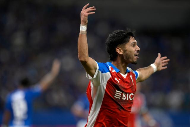 Universidad Catolica's midfielder #14 Jimmy Martinez celebrates after scoring his team's second goal during the Copa Libertadores group stage football match between Brazil's Cruzeiro and Chile's Universidad Catolica at the Mineirao stadium in Belo Horizonte, state of Minas Gerais, Brazil, on April 15, 2026. (Photo by DOUGLAS MAGNO / AFP)