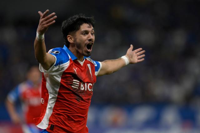 Universidad Catolica's midfielder #14 Jimmy Martinez celebrates after scoring his team's second goal during the Copa Libertadores group stage football match between Brazil's Cruzeiro and Chile's Universidad Catolica at the Mineirao stadium in Belo Horizonte, state of Minas Gerais, Brazil, on April 15, 2026. (Photo by DOUGLAS MAGNO / AFP)