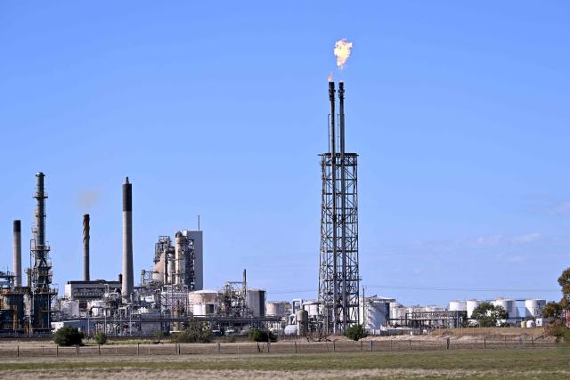This photo shows the the Viva Oil Refinery in Geelong on April 16, 2026 following an overnight fire. Towering columns of fire have engulfed a crucial Australian oil refinery after a chain of explosions, authorities said on April 16 as they warned of disruptions to domestic fuel supply. (Photo by William WEST / AFP)