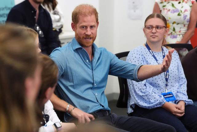 Britain's Prince Harry, Duke of Sussex, talks to young advocates during a visit to Batyr, a mental health engagement programme, at Swinburne University of Technology in Melbourne on April 16, 2026. (Photo by Jonathan Brady / POOL / AFP)