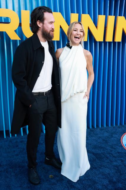 US actress Kate Hudson (R) and partner US musician Danny Fujikawa attend the premiere of Netflix's "Running Point," Season 2, at the Egyptian Theatre in Hollywood on April 15, 2026. (Photo by Patrick T. Fallon / AFP)