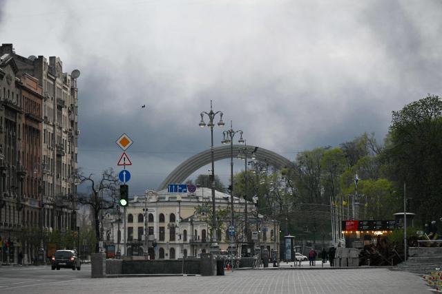 Smoke rises over Kyiv following a Russian strike on April 16, 2026, amid the Russian invasion of Ukraine. Russian strikes killed at least 12 people in Ukraine, local authorities said on April 16, after Moscow pummelled its neighbour in overnight attacks. (Photo by Genya SAVILOV / AFP)